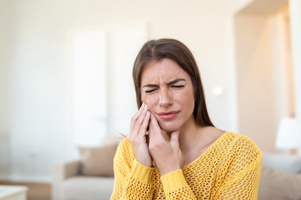 young woman having trismus after wisdom teeth removal